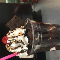 Fudge Brownie Sundae · Your choice of ice cream served on top of a decadent chocolate brownie covered with hot fudg...
