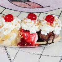 Banana Split Sundae · Chocolate, vanilla & strawberry ice cream with a whole banana and topped with pineapple, str...