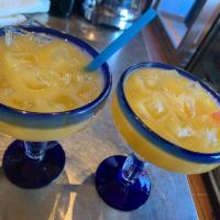 Mango Frozen Margarita 16 oz. · Must be 21 to purchase. Frozen or on the rocks option. 