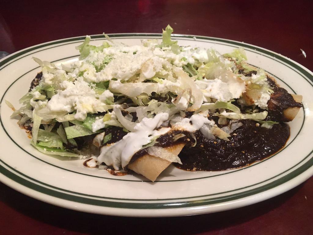 Enchiladas de Mole · Chicken or cheese with mole sauce. Served with rice, beans and tortillas. 