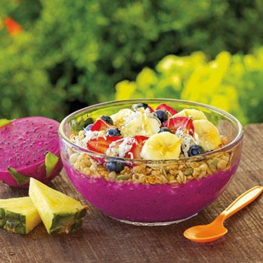 Island Pitaya Bowl · Pineapple Juice, Organic Dragon Fruit, Mangos, Pineapples, Bananas, // Toppings: Bananas, Strawberries, Organic Granola, Blueberries, Honey, Shredded Coconut (Contains Coconut). 