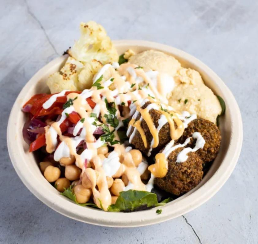 The Vegetarian's Dream Bowl · A dream for vegetarians! This bowl has homemade falafel pieces made from scratch with garbanzo beans and spices using our grandmother's recipe. It's served with house salad, hot pita bread, basmati rice, tzatziki, garlic sauce, and hot sauce. 