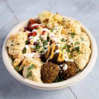 The Sinful Vegetarian Bowl · For falafel and meat lovers out there. This bowl has homemade falafel pieces made from scrat...