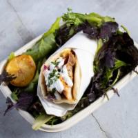 The Chicken Genie Gyro · Marinated Chicken served in a hot pita bread. Served with tomatoes, lettuce, onions, green p...