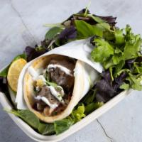 The Genie's Gyro · Doner Style lamb served in a 12 inch tortilla bread. Served with tomatoes, lettuce, onions, ...