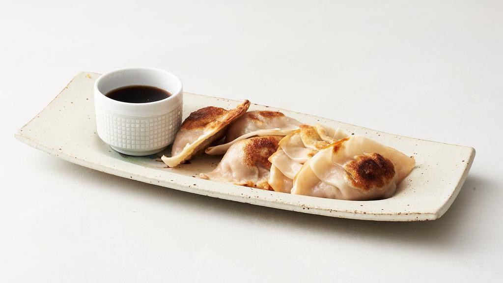 Veggie Gyoza · Five all-veggie filling wrapped into a thinly rolled piece of dough and pan seared until crispy served with a dipping sauce