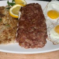 Breakfast Eggs with Corned Beef Hash · Salt cured beef, potatoes, and onions.