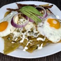 Breakfast Chilaquiles Verdes · Fried tortilla strips simmered in red or green salsa. Served with cojita cheese, sour cream,...