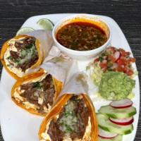 Order of 3 Cheese Birria Tacos · Oaxaca cheese cilantro, onions and guacamole. Served with consome in soft corn tortilla