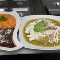 Enchiladas Suizas · 3 soft corn tortillas in green tomatillo sauce, topped with swiss cheese, onions, sour cream...