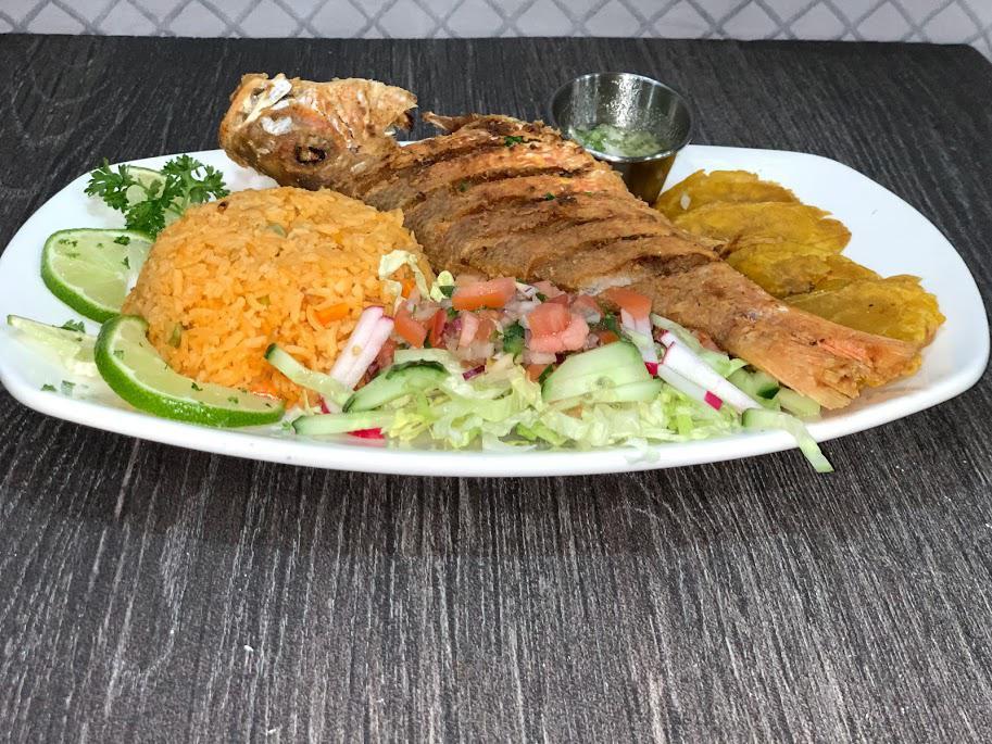 Pargo Rojo Frito · Fried red snapper served with rice,salad and tostones.