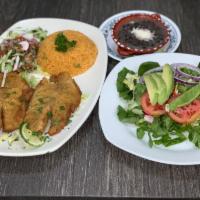 Fried Tilapia · Served with salad, rice and beans.