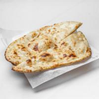 Naan · Traditional Punjabi style tear-drop shaped white bread baked on the sides of our tandoori ov...