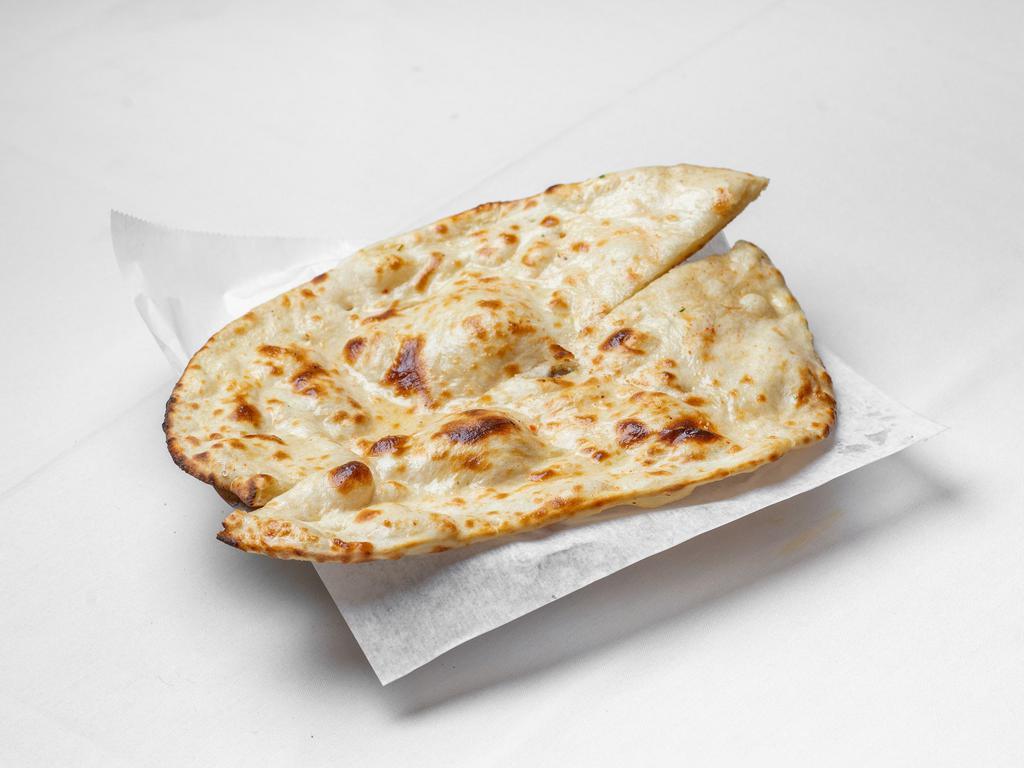 Naan · Traditional Punjabi style tear-drop shaped white bread baked on the sides of our tandoori oven, delicious with or without butter.