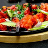 Shrimp Tandoori · Mild, large, mouthwatering shrimp lightly seasoned and slowly broiled over charcoal in tando...