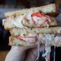 Clobster Grilled Cheese · Lobster and crab mixed into a grilled cheese with awesome sauce. Served with natural cut fri...