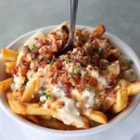Chowder Fries · Natural-cut fries smothered in creamy clam chowder and bacon. Gluten free.
