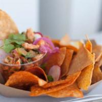 Shrimp Ceviche · Marinated shrimp, tomato, lime, cucumber, and tortilla chips. Gluten free.