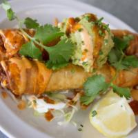 Lobster Taquitos · 2 pieces. Two flour tortillas filled with lobster and cheesy goodness lightly fried then top...