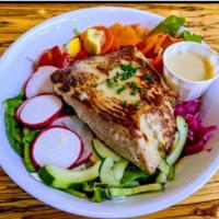 Simply Grilled Fish Salad · Daily fish over fresh mixed lettuces, hand-cut veggies and honey-lime vinagrette. Shown here...