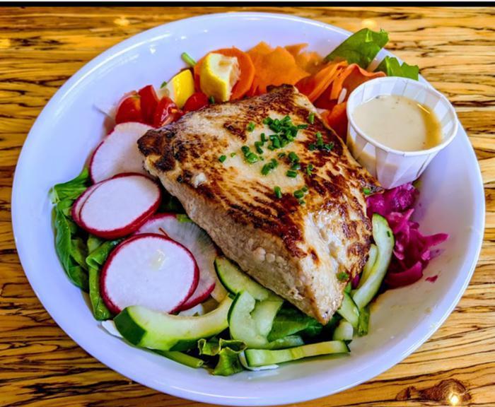 Simply Grilled Fish Salad · Daily fish over fresh mixed lettuces, hand-cut veggies and honey-lime vinagrette. Shown here with Mako shark.  