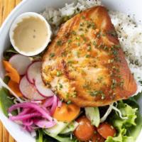 Grilled Fish Bowl · daily fish, seasoned rice, herb sauce, hand picked salsa. Shown here with salmon. 