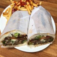 Danny's Philly Cheese Steak Sandwich · The Philly Cheese Steak Sandwich is served with thinly sliced flank steak with onion and gre...