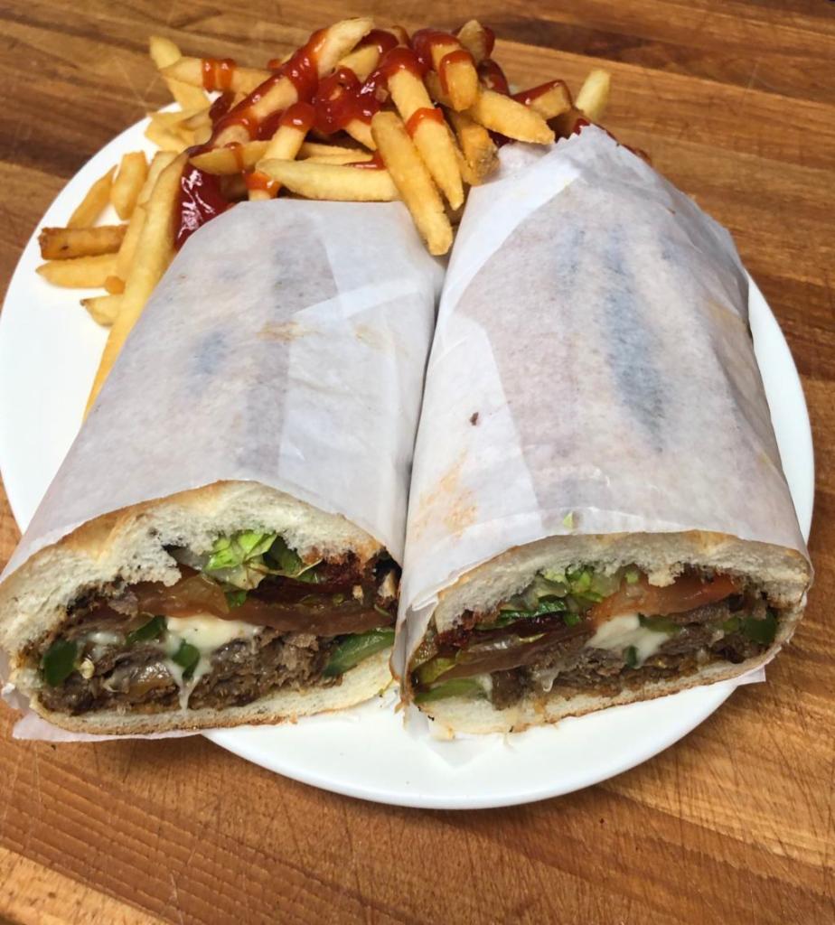 Danny's Philly Cheese Steak Sandwich · The Philly Cheese Steak Sandwich is served with thinly sliced flank steak with onion and green peppers on a hero. No lettuce or tomatoes comes in the sandwich.