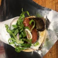 Danny's Lamb Gyro · The Lamb Gyro is served with romaine lettuce, lamb, tomato, onions and tzatziki sauce.