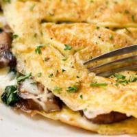 Western Omelette · Serve with 3 eggs omelet, ham, peppers, onions, toast bread and hashbrown.