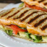 The Monte Panini · Thin sliced ham, turkey and Swiss cheese, sliced tomatoes with honey mustard dressing serve ...