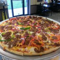 Taco Pizza · Ground beef, cheddar cheese, diced tomato, lettuce and tortilla chips.