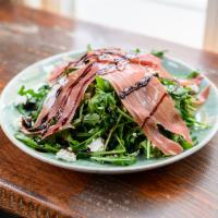 3. Arugula Salad · Goat cheese, dried cranberries, honey, balsamic glaze, and olive oil. Add prosciutto for an ...
