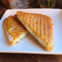 2. Cheese Panini · Manouri, graviera, vlahotyri, and truffle oli.