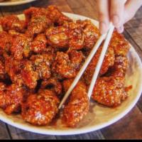 Red hot pepper chicken · Crispy and tender chicken tossed in our addictive gochujang sauce