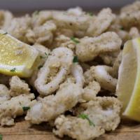 Calamari Fritti · Tender pieces of calamari are dredged in our own seasoned flower, fried to perfection and se...