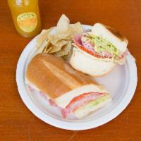 Italian Sandwich · Ham, salami, pepperoni and provolone cheese with romaine lettuce, tomatoes, onion, oil, vine...