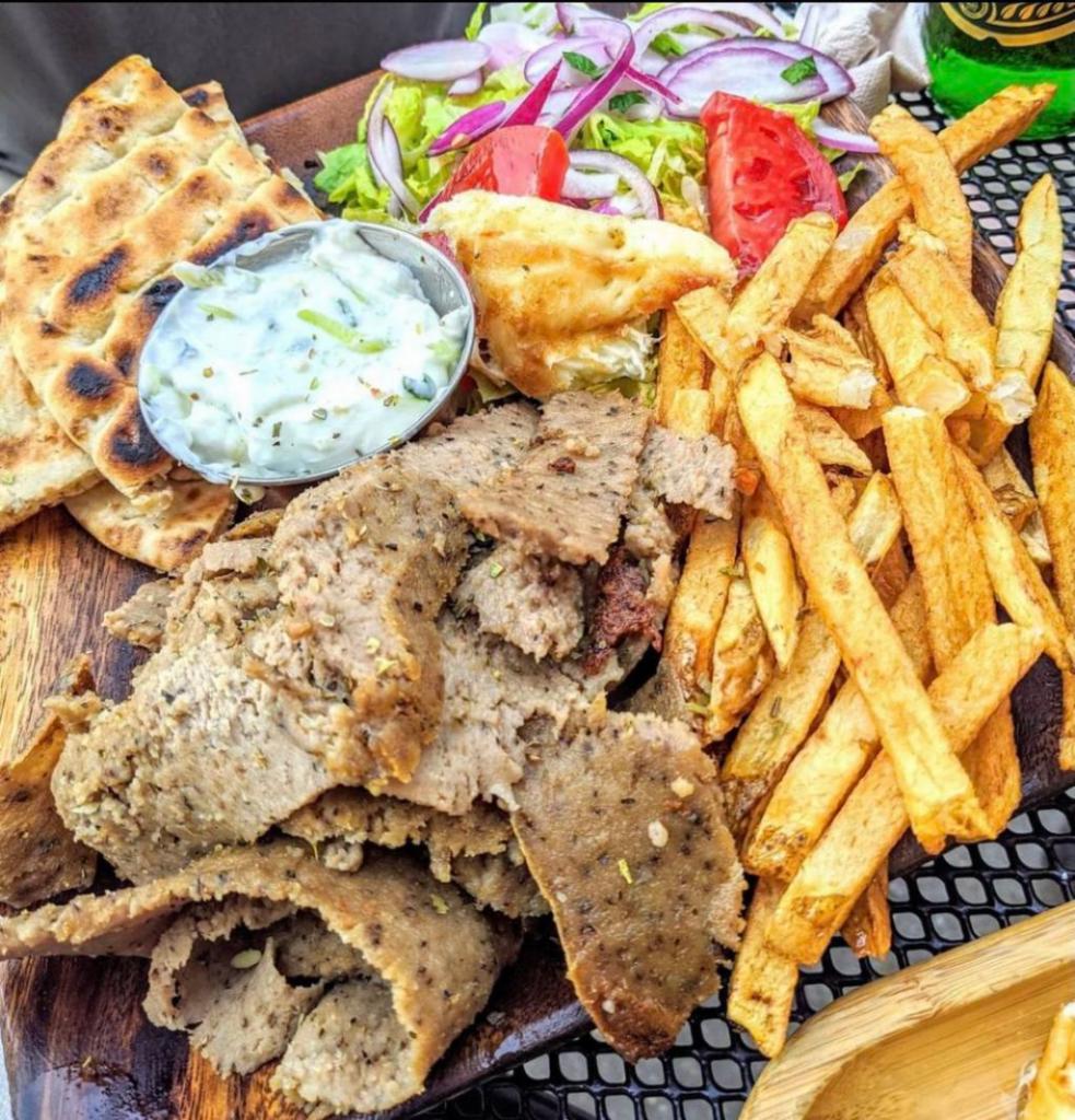 Lamb & Beef Gyro Platter · Double portion of our slow roasted, Hand-stacked Lamb & Beef Gyro over our Handcut Fries or Yellow Rice.
Comes with a side salad and your choice of bread, sauce, and toppings.
