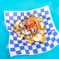 Greek Nacho Bowl · Fluffy grilled pitas topped with gyro or chicken meat, homemade tzatziki sauce, feta cheese,...