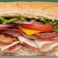 Ultimate Club Sub · Freshly-sliced ham, turkey, and crispy bacon.