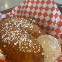 Pie Bombs · 2 apple pie bombs smothered in cinnamon and served with a side of sea-salt caramel dipping s...