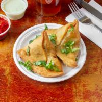 Vegetable Samosa · Crisp patties filled with mildly spiced potato and green peas.