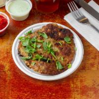 Chapli Kabab · Ground chicken blended with spices and fried in Khyberi style.