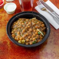Samosa Chaat · Vegetable turnover with chickpeas and sweet and sour chutney.