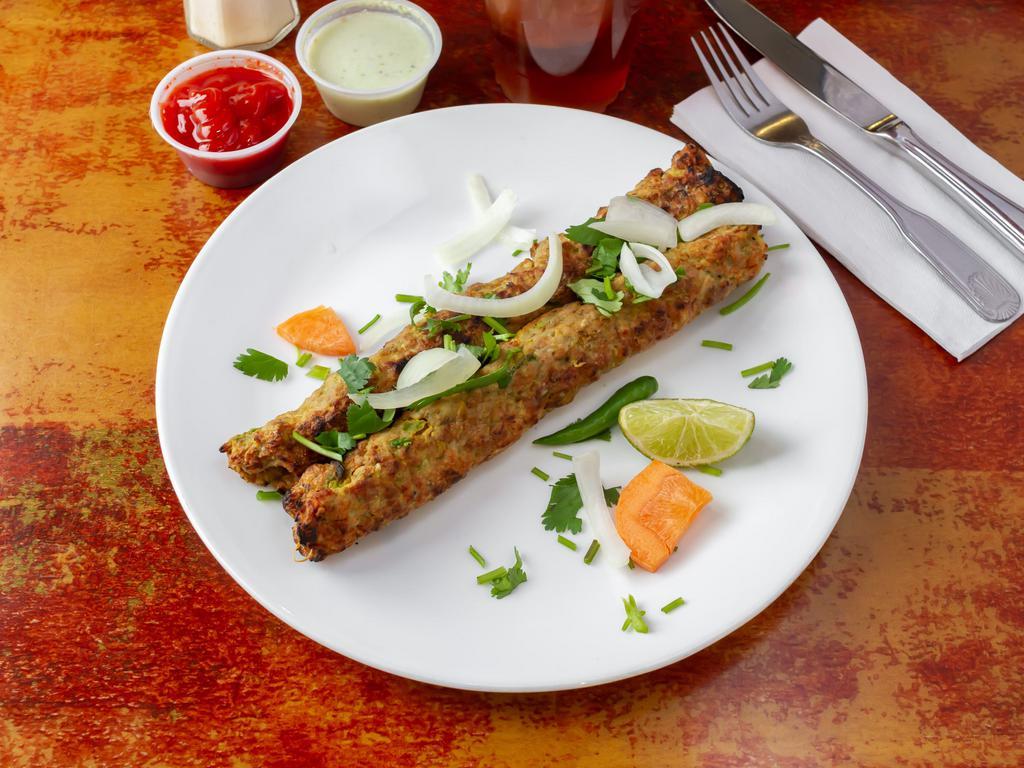 1 Piece Chicken Seekh Kabab · Minced chicken kabab seasoned with onion, spices and herbs and barbecued in a clay oven.