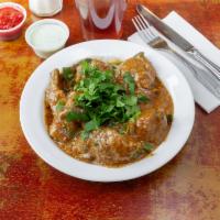 Chicken Curry · Pieces of chicken gently cooked in a thick sauce.