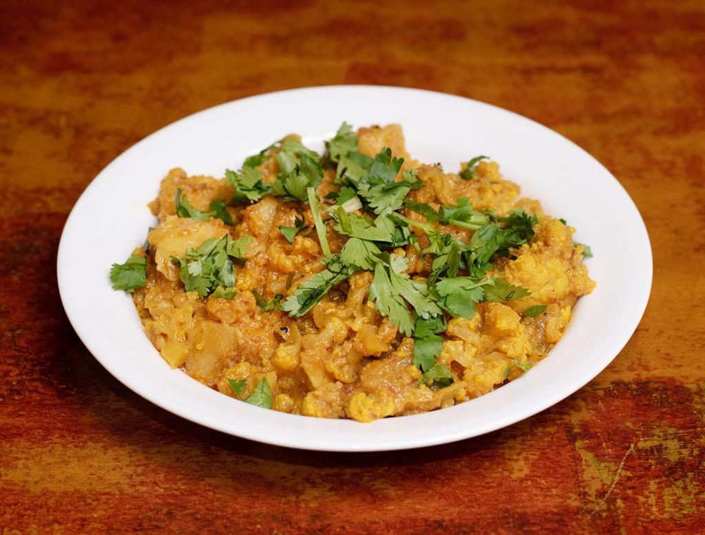 Aloo Gobi · Potatoes and cauliflower cooked with fresh tomatoes, onions and spices.