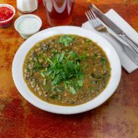 Daal Makhni · Lentils cooked with butter, ginger, onion and peppers.