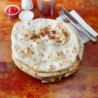Paratha · Multi-layered whole wheat delicately prepared with butter.