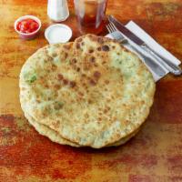 Aloo Paratha · Whole wheat bread filled, spiced and freshly baked in a tandoor clay oven.